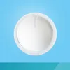 A single, white, circular nursing pad with a textured surface and a small slit in the top center, set against a light blue background. Produktbild-Vorschau