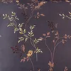 A close-up view of a fabric with a floral pattern. Anteprima dell’immagine prodotto