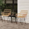 Two rattan chairs and a small table on a patio. Podgląd zdjęcia produktu