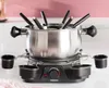 A fondue set is displayed on a countertop. Produktbild-Vorschau