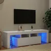 A white TV stand with blue LED lighting is shown in a living room setting. Náhľad obrázku produktu