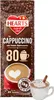 A bag of HEARTS Cappuccino with a cup of prepared cappuccino shown next to it. Produktbild-Vorschau
