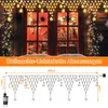 A festive outdoor scene with Christmas lights decorating a window and a diagram showing the dimensions of the lights. Produktbild-Vorschau