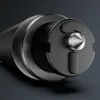 A close-up view of the tip of a black safety hammer with a silver metal tip. Náhľad obrázku produktu