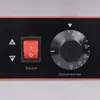 Close-up of a control panel with a switch and a temperature dial. Náhled obrázku produktu