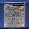 A metal nameplate with product specifications and wiring diagrams, attached to a blue machine. Produktbild-Vorschau