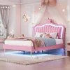 A child's bedroom with a pink upholstered bed as the main focus, decorated in a princess theme. Produktbild-Vorschau
