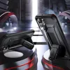 Two black phone cases with kickstands are displayed on a futuristic, multi-layered platform with red accents and smoke effects. Produktbild-Vorschau