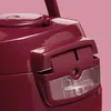 A close-up of a maroon kitchen appliance with a transparent window. Produktbild-Vorschau
