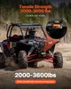 A person driving a red and black ATV in a sandy, wooded area. Podgląd zdjęcia produktu
