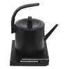 A black electric kettle with a gooseneck spout sits on its charging base. Podgląd zdjęcia produktu