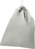 A silver drawstring bag is shown against a white background. Náhled obrázku produktu