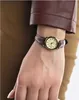 A close-up shot of a woman's wrist wearing a watch. Produktbild-Vorschau