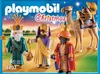 The image shows a Playmobil Christmas set featuring the Three Wise Men and a camel, presented on a desert-like background with a starry sky. Náhled obrázku produktu