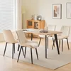 A dining room setting with a table and chairs. Produktbild-Vorschau