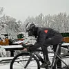 A person riding a bicycle in a snowy environment. Anteprima dell’immagine prodotto