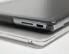Close-up view of the edge of two electronic devices, likely laptops or tablets, stacked on top of each other. Produktbild-Vorschau