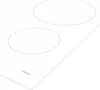 A close-up, angled view of a white induction cooktop with two heating zones visible. Voir les images du produit