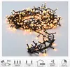 A cluster of warm white LED lights on a black wire, displayed on a light gray and white background. Several icons with text are present at the bottom. Produktbild-Vorschau