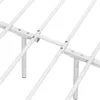 A close-up view of the white metal frame of a bed. Produktbild-Vorschau