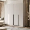 A modern bedroom with a large wardrobe, a window seat, and a rug. Produktbild-Vorschau