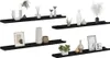 Four black wall shelves are displayed against a white background, each decorated with various decorative items such as vases, picture frames, and plants. Podgląd zdjęcia produktu