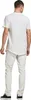 A man wearing a white t-shirt and light-colored pants, viewed from the back. Produktbild-Vorschau