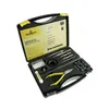 A watchmaker's tool kit is open, displaying various tools inside a black case with yellow accents. Anteprima dell’immagine prodotto