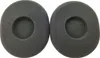 Two grey foam ear pads for headphones are shown side-by-side against a white background. Voir les images du produit