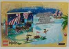 The back of a LEGO Pirates Advent Calendar box, depicting a pirate scene with a ship and beach. Produktbild-Vorschau