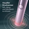 Close-up of a pink electric toothbrush with text overlay describing its features. Anteprima dell’immagine prodotto