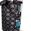 A close-up of a shopping trolley bag with a water bottle in a side pocket. Produktbild-Vorschau
