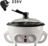 A white electric multi-cooker with a glass lid and black handle, shown on a white background with a power plug and voltage indicator in the top left corner. Produktbild-Vorschau