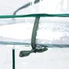 A close-up view of a green strap tied to a clear plastic cover of a mini greenhouse. Náhled obrázku produktu