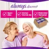 Two women are smiling and looking at each other, with a box of Always Discreet products in the background. Podgląd zdjęcia produktu