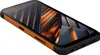 A rugged smartphone with an orange frame and a dark, abstract wallpaper on its screen, shown at an angle against a white background. Voir les images du produit