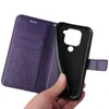 A hand is holding a purple flip phone case open, revealing the black inner shell where a phone would be placed. Produktbild-Vorschau