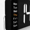 A close-up of a digital clock displaying the days of the week and time. Náhled obrázku produktu