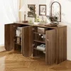 A wooden sideboard with open doors, displaying shelves with books and decorative items, in a well-lit room with blinds casting shadows. Podgląd zdjęcia produktu