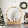 A cat is resting inside a wooden cat wheel in a room decorated for Christmas, with a Christmas tree, wreath, and presents. Voir les images du produit
