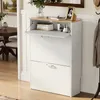 A white shoe cabinet with a wooden top, shown in a hallway or entryway. Produktbild-Vorschau