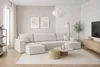 A modern living room with a large sectional sofa, coffee table, and TV. Produktbild-Vorschau