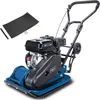 A blue and black plate compactor with a black handle and a small black wheel, shown on a white background. To the upper left of the compactor is a black rubber mat and some screws.
