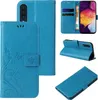 A collage of images showing a blue flip phone case with floral and butterfly embossing. Produktbild-Vorschau