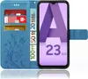 A blue flip case for a Samsung Galaxy A23 5G phone, showing credit cards and euro banknotes inserted into the case's card slots. Produktbild-Vorschau