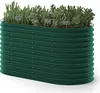 A green corrugated metal raised garden bed filled with herbs. Voir les images du produit