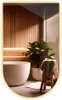 A modern bathroom with a freestanding bathtub, wooden wall paneling, and a potted plant. Produktbild-Vorschau