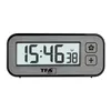 A digital clock with a gray frame and a white display showing the time and temperature. Anteprima dell’immagine prodotto
