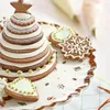 A Christmas-themed gingerbread cake stand decorated with cookies. Náhled obrázku produktu