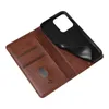 A brown leather flip phone case is open, revealing the black phone holder inside. The case has card slots and a small oval window. Produktbild-Vorschau